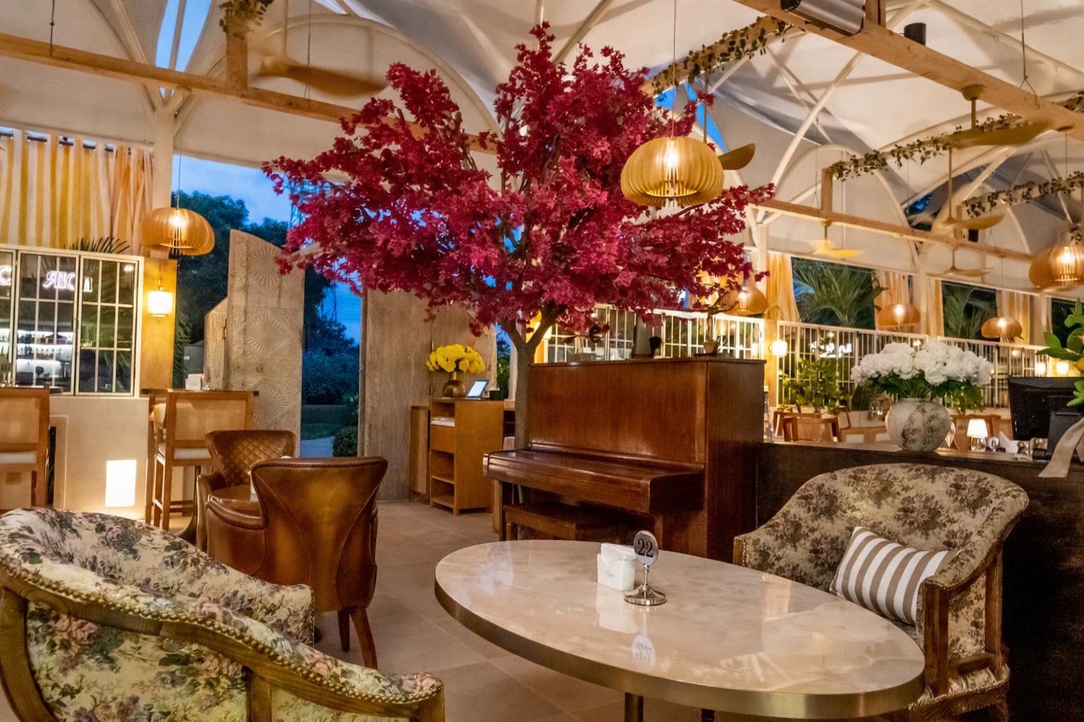 Le Comptoir piano bar beneath the signature fuchsia tree